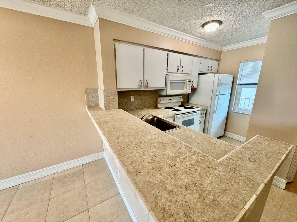 Photo of 2104 S Cypress Bend Drive #404, Pompano Beach, FL 33069 (MLS # F10545487)