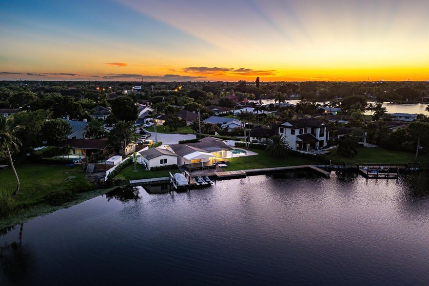 Discover a rare gem on the shores of Lake Osborne.  This 3 bdrm, 2 bath house sits on 187 feet of open waterfront overlooking a natural bird sanctuary, offering endless potential and breathtaking views.  The property has been gutted and is ready for total renovation, making it a blank canvas for your dream home.  Whether you're a homeowner ready to design every detail to your taste, or a builder seeking a prime opportunity to transform and resell, this property offers unmatched versatility and potential. Perfect for boating, fishing or just relaxing on the deck looking at the natural paradise. The house also comes with complete architectural plans expanding the square footage, raising the roof and connecting the garage to the house, creating an expansive waterfront masterpiece.