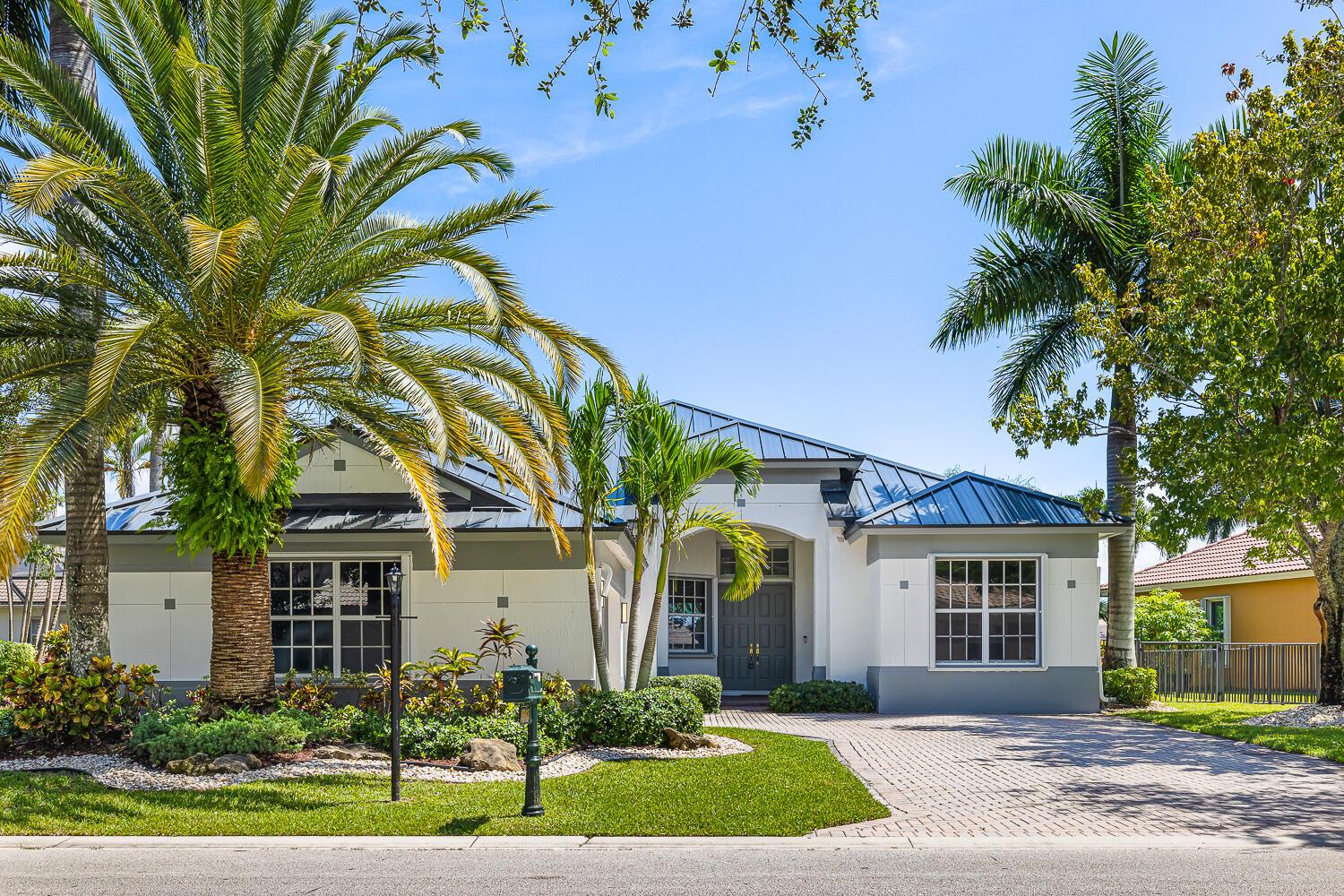 Welcome to Parkland Isles, a 4 bedroom, 3 bath home with wide water views and a layout made for easy living. Inside you'll find split bedrooms, an office with built-ins, granite counters, tile floors, and open spaces filled with light. Outside, enjoy a heated saltwater pool, covered patio, and brand new shutters with a 10-year warranty. A new metal roof adds peace of mind, and the home is fully updated and move-in ready. A golf cart is included with the sale, perfect for school drop-offs without the car line. Parkland Isles offers resort-style amenities in a gated community, centrally located with easy access to the Sawgrass Expressway and Florida Turnpike.