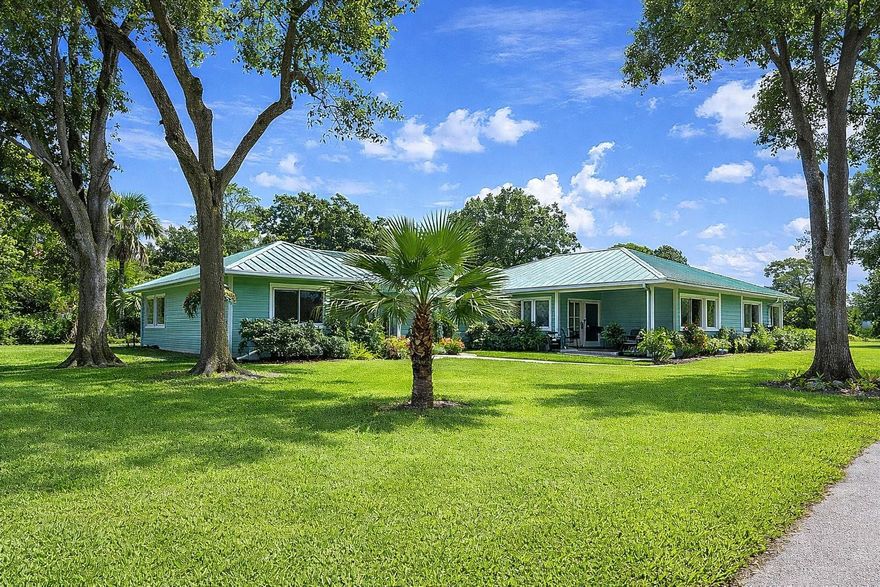 Extensively updated in 2021–2022, this custom-designed residence showcases quality workmanship and high-end finishes throughout. The home features new flooring including ¾” solid hickory, mosaic tile, and polished porcelain, creating a rich and cohesive design across the living spaces. The entire property has been fully re-piped, and the country-style kitchen is outfitted with hickory cabinetry and all new appliances. A light-filled sunroom offers impact-rated windows and a distinctive black-and-white checkerboard tile floor, while the formal living and dining rooms provide refined entertaining areas.  The spacious family room is highlighted by a floor-to-ceiling brick fireplace and multiple solar tubes, with additional solar tubes placed throughout the home to maximize natural light. The exterior is equally impressive, featuring a newly painted green copper roof and coordinated exterior paint. Set on 1.16 acres of landscaped grounds, the property includes a sprinkler system and offers exceptional privacy. The resort-style pool has been completely refreshed with new resurfacing, aqua glass tile, updated coping, a waterfall feature, and a decorative pedestal. The lanai is finished with imported ¾” tile from Portugal and opens to a brand-new pool enclosure with new equipment. Additional upgrades include a tankless water heater, brand-new roof, dedicated sewing and laundry rooms, no HOA, and a large storage shed. Located on a quiet cul-de-sac of only eight custom homes, this property offers a rare combination of privacy and convenience, just minutes from shopping, dining, banking, and the beach. A truly distinctive home in a prime Vero Beach location.