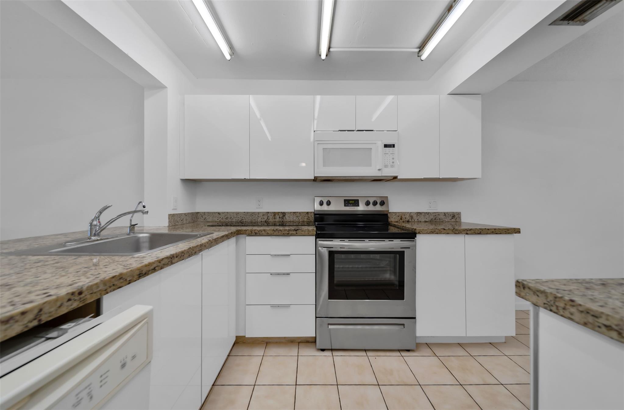 This beautifully kept unit offers a rare 3-bedroom, 2-bath layout in Coral Springs, hard to find and even harder to beat at this price! Featuring tile floors throughout the living areas and laminate flooring in the bedrooms, this home offers both comfort and durability. The kitchen is oversized with plenty of counter space and a cozy breakfast area, perfect for everyday living. Enjoy fantastic amenities just steps from your door: swimming pool, tennis courts, and basketball courts, ideal for families or an active lifestyle. Includes full-size washer and dryer inside the unit. Best deal in town; schedule your showing today!