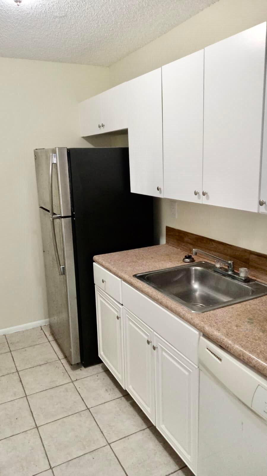 Photo of 1200 LAKE VICTORIA Drive #C, West Palm Beach, FL 33411 (MLS # B26080263)