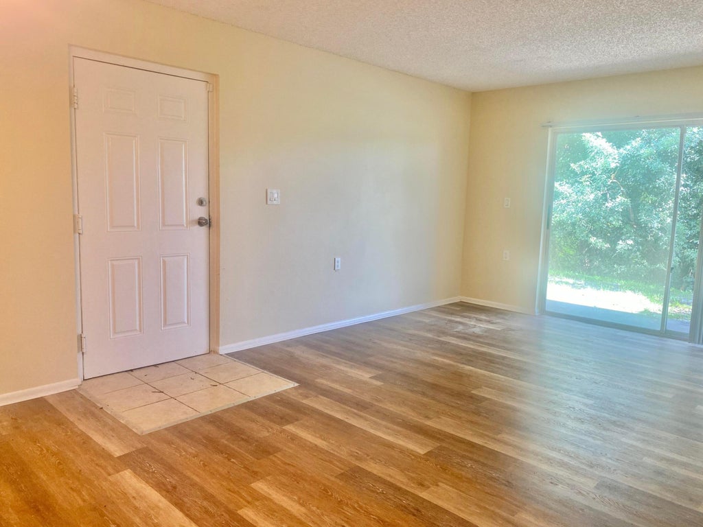 Photo of 1200 LAKE VICTORIA Drive #C, West Palm Beach, FL 33411 (MLS # B26080263)
