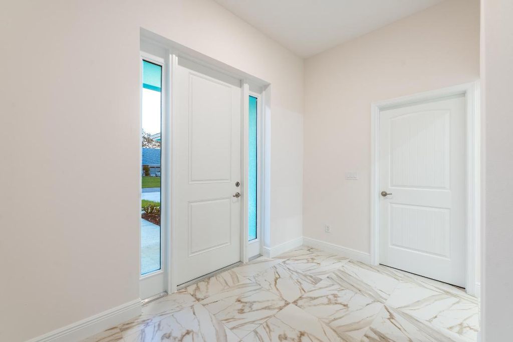 Photo of 721 SW Hogan Street, Port Saint Lucie, FL 34983 (MLS # R10934844)