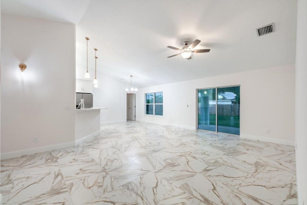 Photo of 721 SW Hogan Street, Port Saint Lucie, FL 34983 (MLS # R10934844)