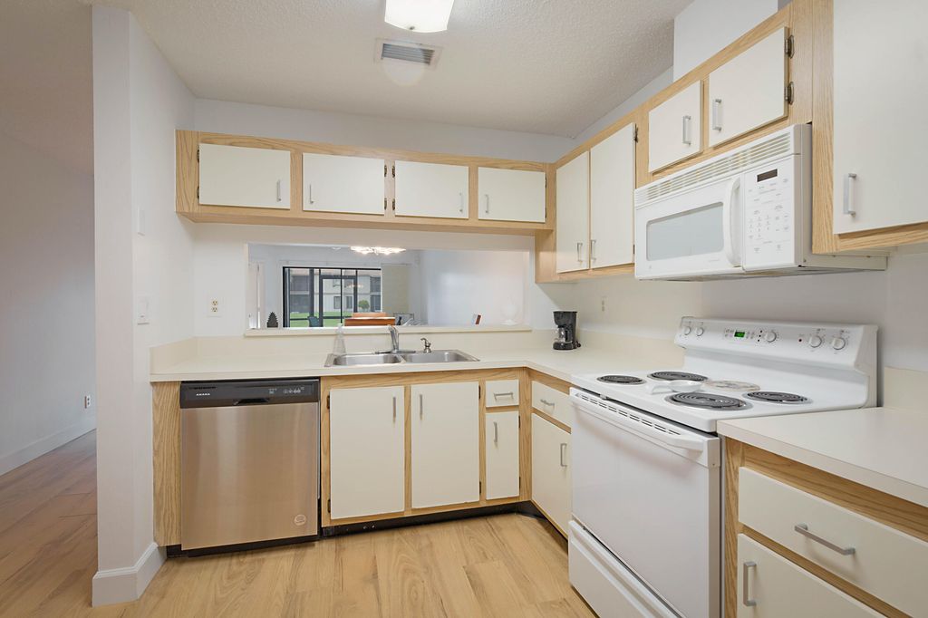 Photo of 903 Harbour Pointe Way, Greenacres, FL 33413 (MLS # B26011568)