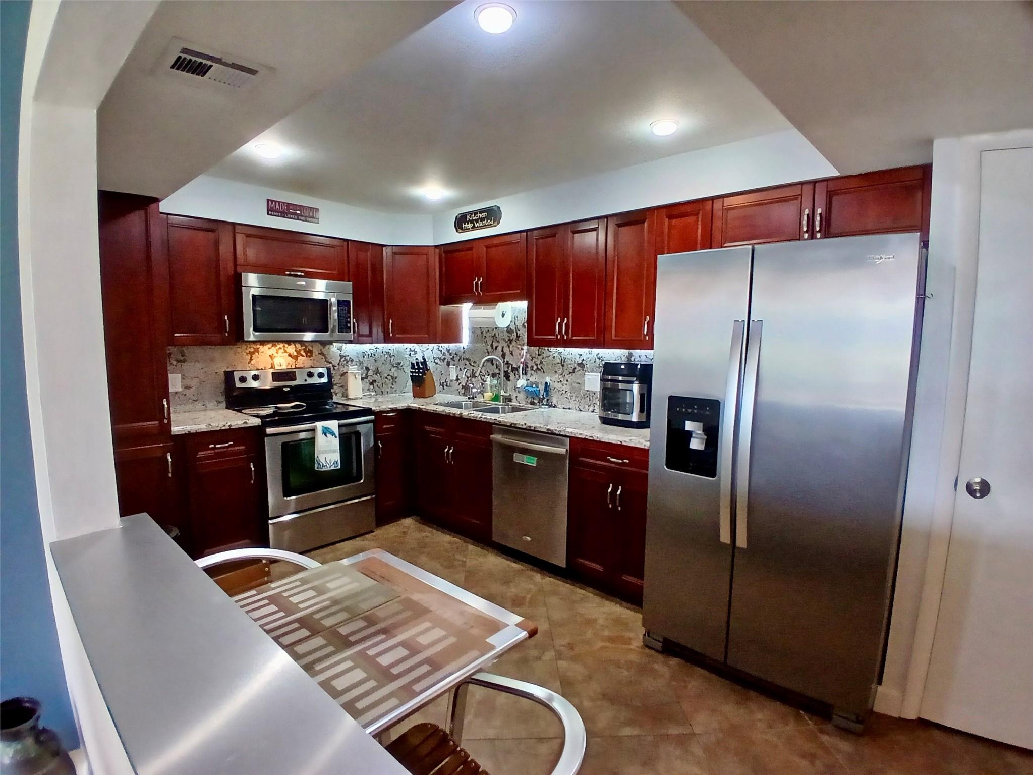 RARE FIRST FLOOR KING MODEL! The King Model is the Largest Floor Plan in Palm Aire and this Home also has an Enclosed Patio and Excellent Views from All Windows. Enjoy the Convenience of First Floor Living with Plenty of Living Area, Large Closets and Oversized Master Bedroom. This Home Has a Renovated Kitchen with Granite and SS Appliances and Under Cabinet Lighting. Both Bathrooms have Partial Updates and are in Good Condition. Large Laundry Room in the Home. Newer 2024 AC and 2022 WH. The Association's Financials are Excellent. Roof and Parking Lot Paving Recently Completed along with the 40 YR Inspection. Maintenance Includes Water, Internet, Cable, Building Insurance, Security Patrol, Sewer & Trash, Common Area, Amenities. This King Model Condo Feels Like a SF Home. Live Like a King!
