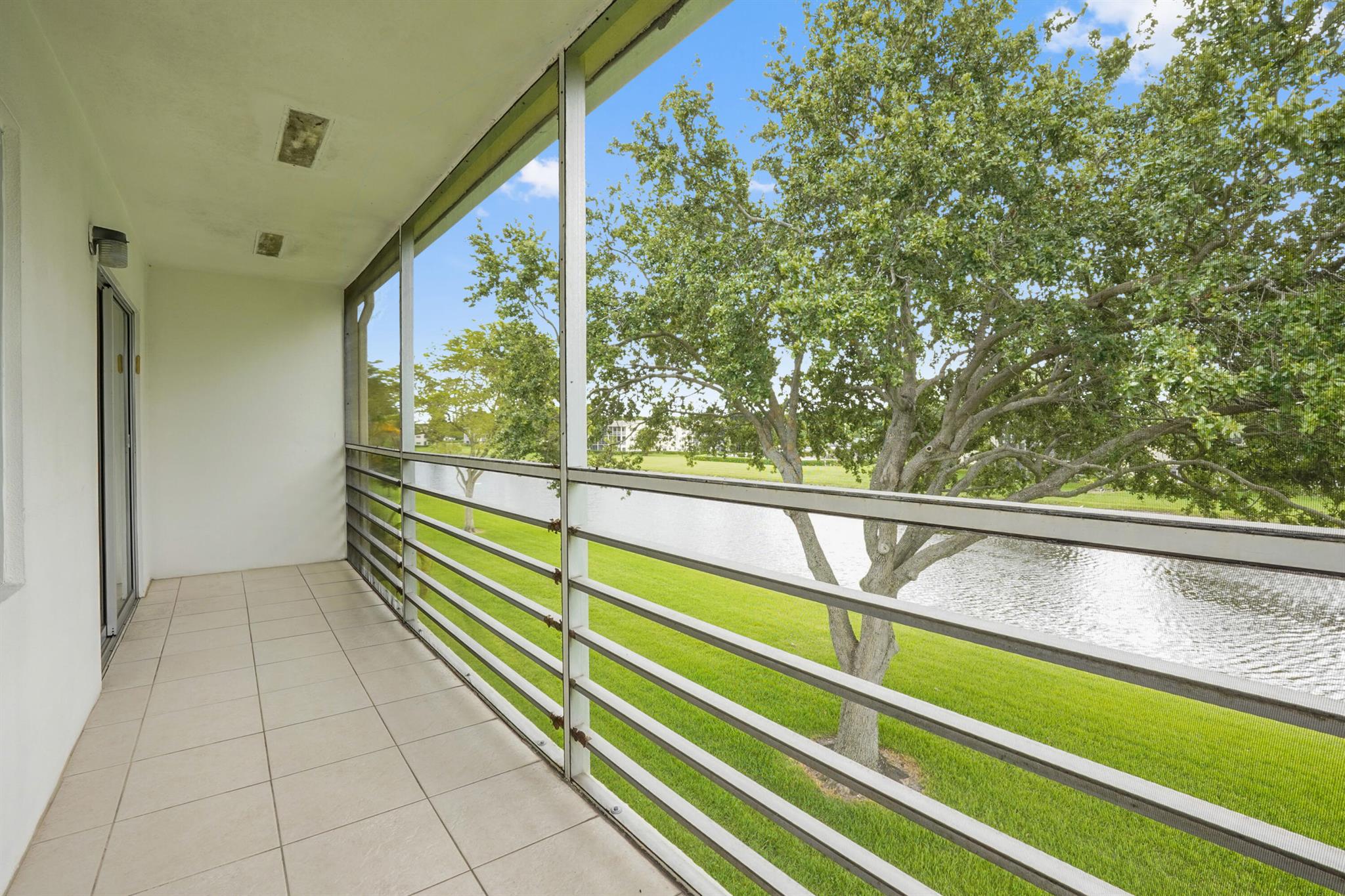 CENTURY VILLAGE--ACTIVE ADULT COMMUNITY, 55+ COMMUNITY.This fantastic condo is in the highly coveted Century Village Active Adult Community. The unit is on the third floor in a peaceful and tranquil location, offering a breathtaking lake view. The screened-in patio has ample space for seating, dining, and entertainment. The building is conveniently located, just a 5-minute walk to the gate and a 10-minute walk from places of worship and the clubhouse. The monthly HOA payments include WiFi, basic cable, and water, making it a hassle-free living experience for residents. Moreover, residents can enjoy world-class amenities, including a fitness center, social spaces, a performance theater, and more, all housed in the expansive clubhouse.