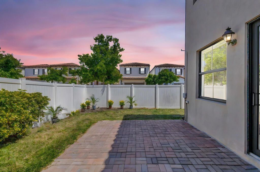 Photo of 6028 Pine Tree Way, Riviera Beach, FL 33410 (MLS # R11107090)