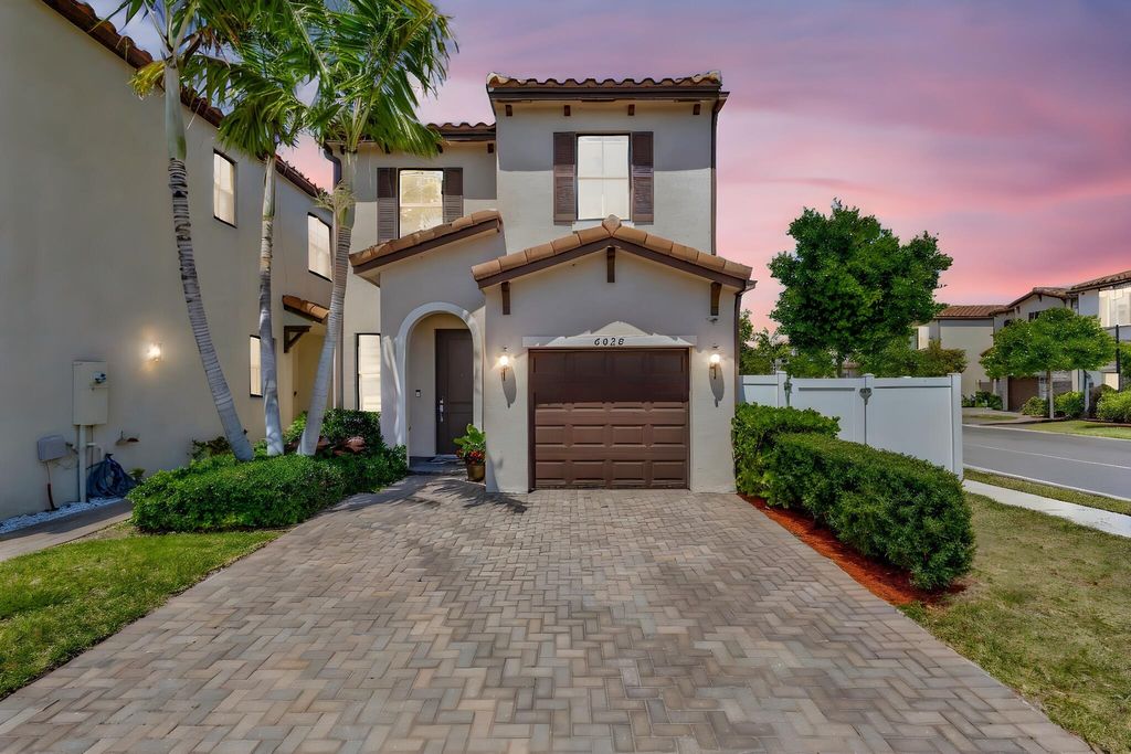 Photo of 6028 Pine Tree Way, Riviera Beach, FL 33410 (MLS # R11107090)