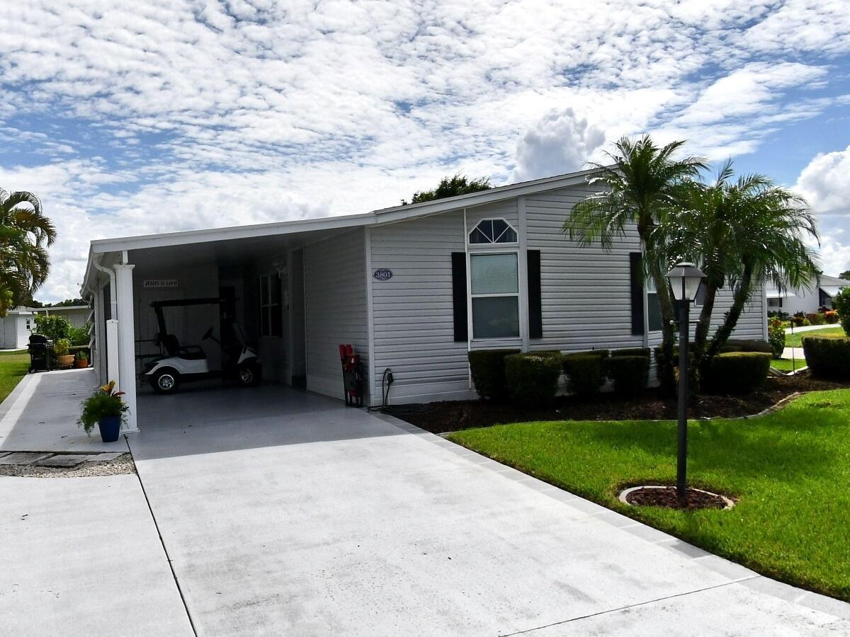 LAND-OWNED corner lot furnished home. Upgraded kitchen with quartz counter tops & newer appliances. Main area tastefully tiled, bdrms carpeted. Split floor plan. Lanai with separate AC. Outside patio. No homes behind this property. Owner is including 4 seater golf-cart with newer batteries.