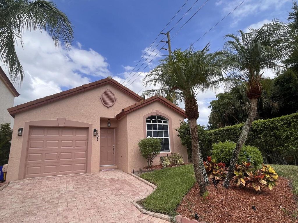 Photo of 1107 Via Jardin, Riviera Beach, FL 33418 (MLS # R11134085)
