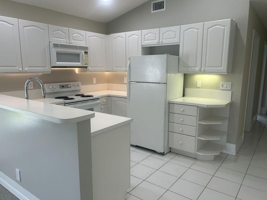 Photo of 1107 Via Jardin, Riviera Beach, FL 33418 (MLS # R11134085)