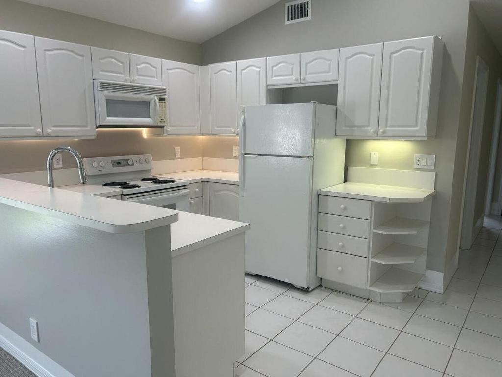 Photo of 1107 Via Jardin, Riviera Beach, FL 33418 (MLS # R11134085)