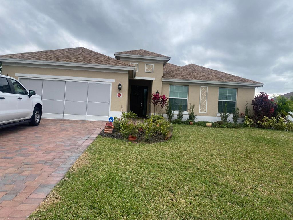 Photo of 656 SW Haas Avenue, Port Saint Lucie, FL 34953 (MLS # R11121923)