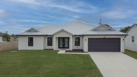 Photo of 1322 SW Calmar Avenue, Port Saint Lucie, FL 34953 (MLS # B26089425)