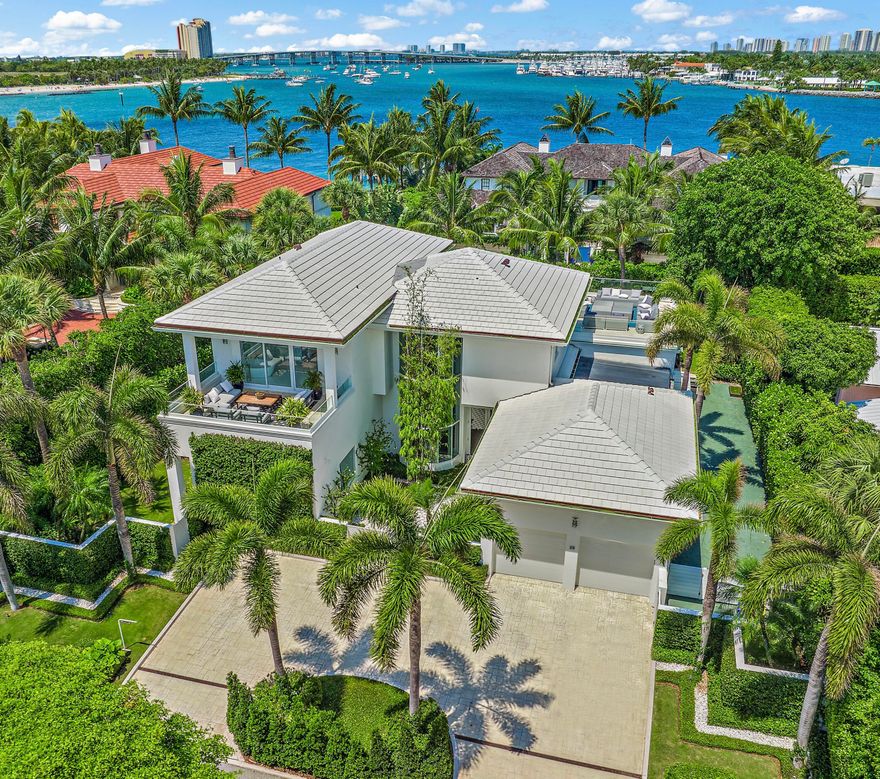 Re-imagined by Todd Michael Glaser, this modern masterpiece on the North End of Palm Beach has nearby  beach and Intracoastal Waterway access. Ideal for early morning walks, surfing, kite boarding & multiple leisure & contemplative pursuits. This chic 5 bedroom with 5.1 bath residence features over 7,000 total square feet, floor to ceiling windows, a stunning floating glass staircase, high ceilings throughout, a new gourmet eat-in-kitchen, & a spacious primary suite with a sitting room. Stylish, glass railing upper deck with water views is a highlight of this residence & is perfect for entertaining. A 2-car garage new impact windows & doors, new floors, new roof, & manicured landscaping completes the offering. A Palm Beach jewel.