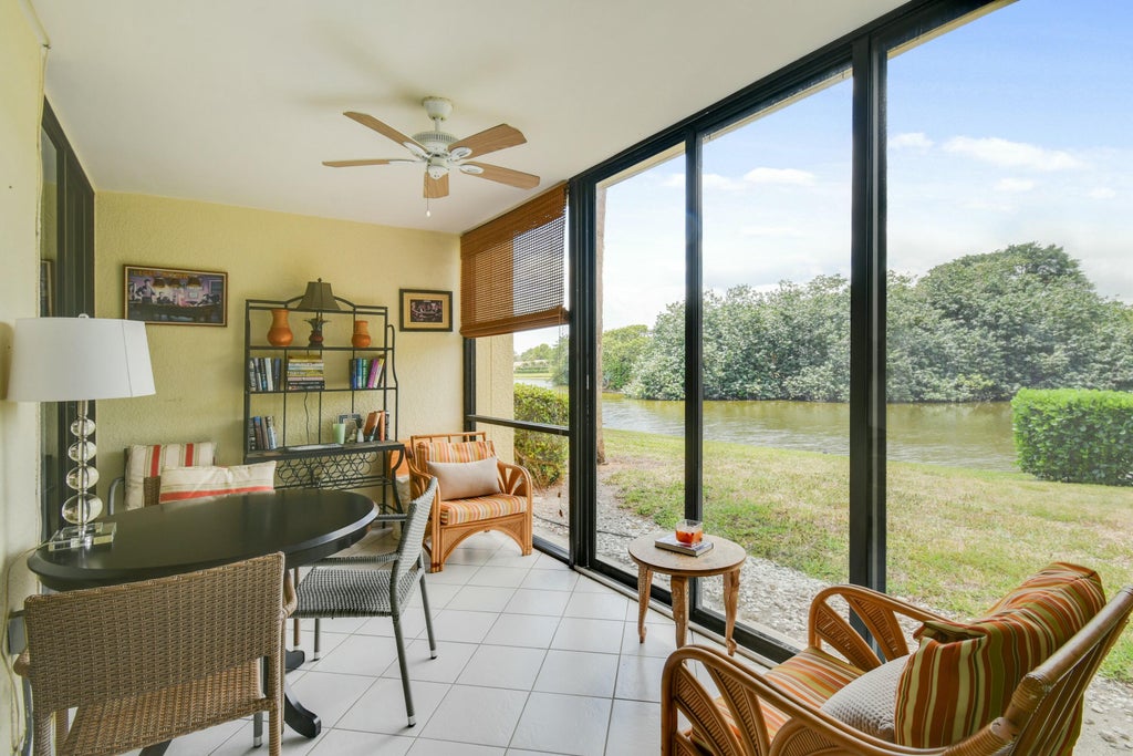 Photo of 5250 Woodland Lakes Drive #128, Palm Beach Gardens, FL 33418 (MLS # R11084718)