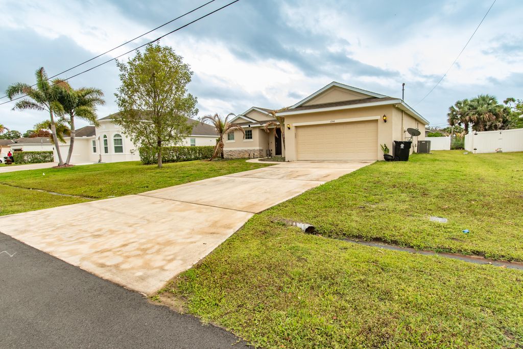 Photo of 1244 SW Ermine Avenue, Port Saint Lucie, FL 34953 (MLS # B26025760)