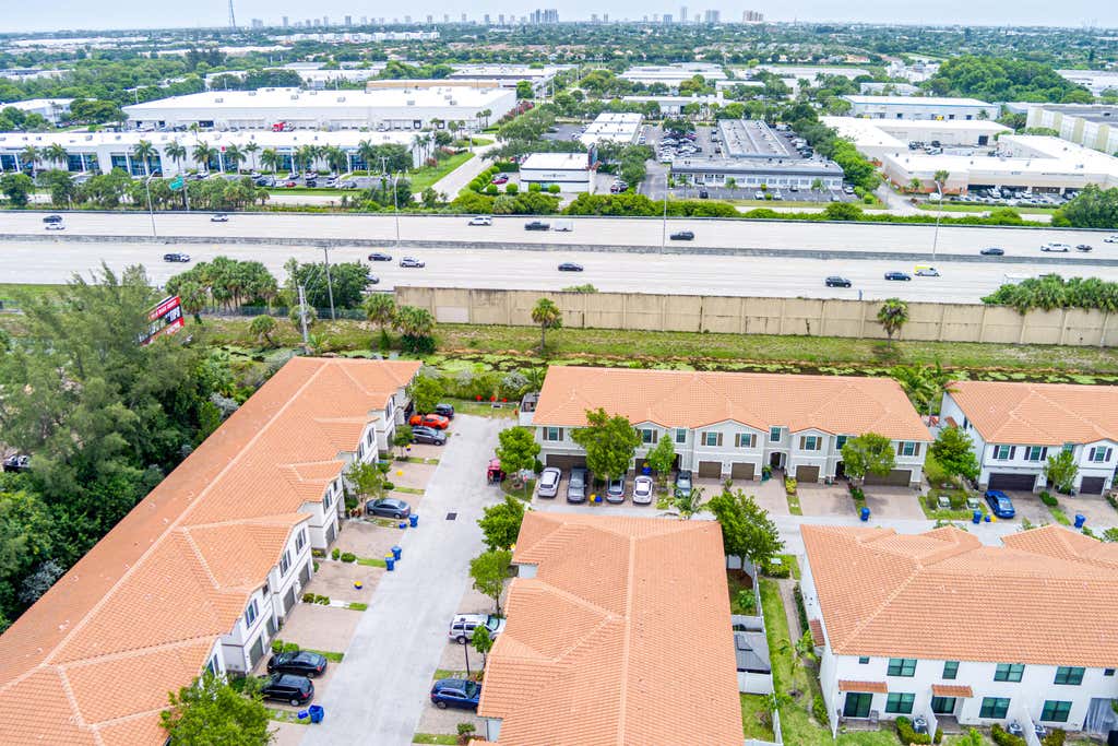 Photo of 1009 Sweet Briar Lane, Riviera Beach, FL 33410 (MLS # B26043642)