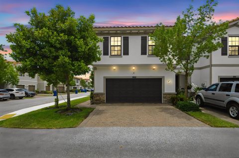 Photo of 1009 Sweet Briar Lane, Riviera Beach, FL 33410 (MLS # B26043642)