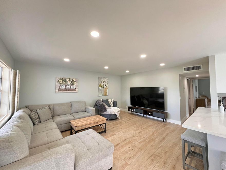 Fully renovated 2BR/2BA furnished condo in Kings Point 55+ community. Open concept kitchen with quartz countertops, white shaker cabinets, kitchen island with bar seating, stainless steel appliances, deep sink, and recessed lighting. New luxury vinyl flooring throughout. Bright living space with modern finishes. Primary bedroom has a custom walk-in closet with built-ins (drawers + hanging). Updated bathrooms with glass shower and built-in shelving. Screened patio with garden view and beautiful tile flooring. In-unit full size washer and dryer in separate laundry room with extra storage. Gated community with resort-style amenities: indoor pool, outdoor pools, clubhouse, fitness center, pickleball, tennis, and on-site restaurants. Atrium (7-10 AM) and Bistro (11 AM-10 PM).