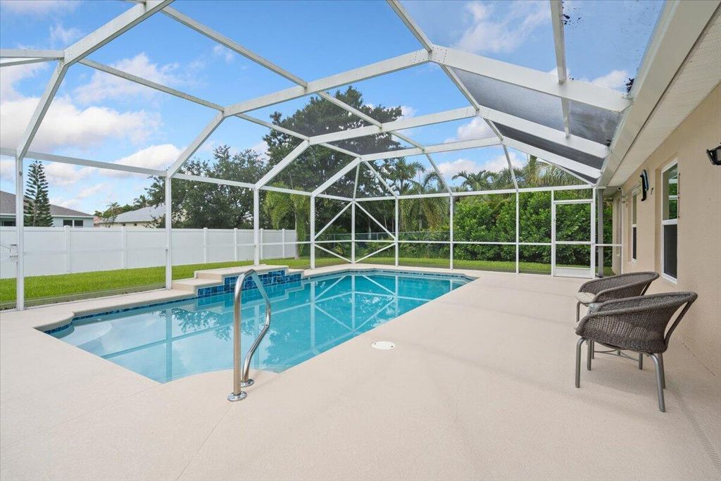 Photo of 516 SW Crawfish Drive, Port Saint Lucie, FL 34953 (MLS # R11103637)