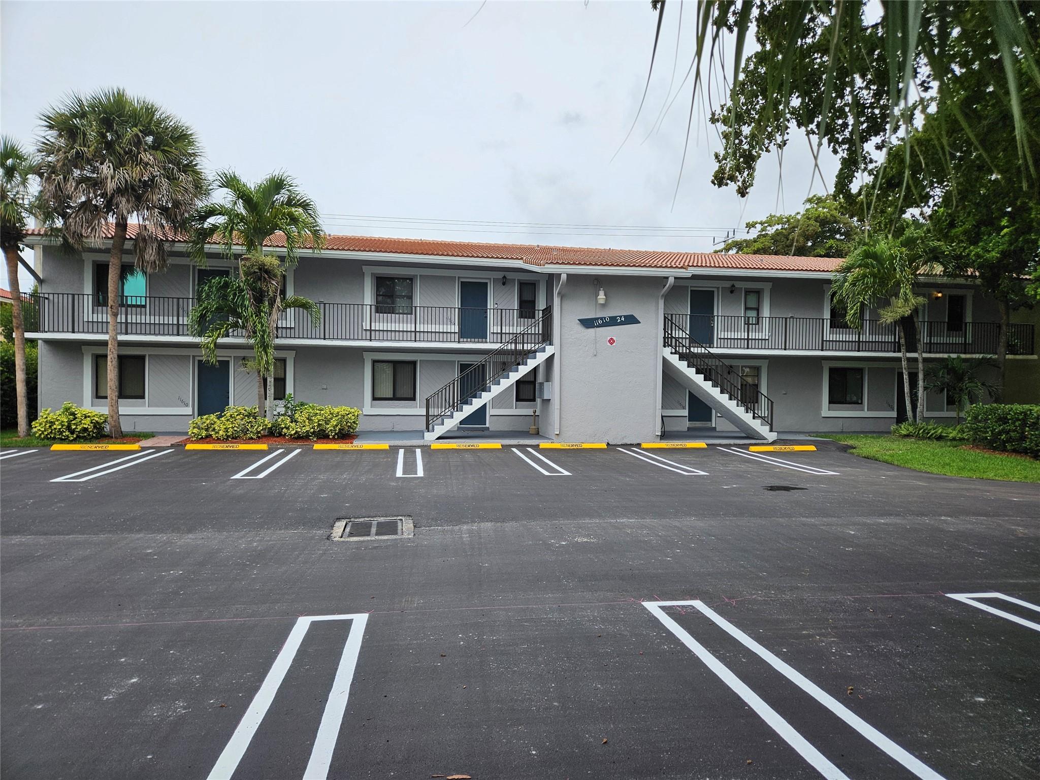 Spacious 3-bedroom, 2-bath ground-floor corner unit featuring a screened patio, in-unit washer & dryer, walk-in closets, and a bright eat-in kitchen. Enjoy added peace of mind with impact windows throughout. This well-maintained condo on a cul-de-sac street offers easy access and privacy in a desirable Coral Springs location. The association has recently completed MAJOR IMPROVEMENTS including a NEW roof, FRESH EXTERIOR PAINT, and a NEWLY PAVED AND PAINTED parking lot—with no upcoming assessments for the new buyer at this time. This unit is ideal for anyone seeking a functional and comfortable living space. Move-in ready and easy to show! Don't miss out on this rarely available ground-floor corner unit!
