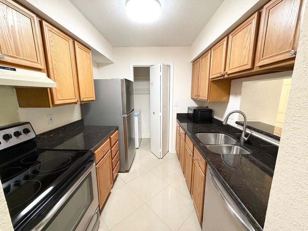 Photo of 755 Riverside Drive #1335, Coral Springs, FL 33071 (MLS # B26038239)