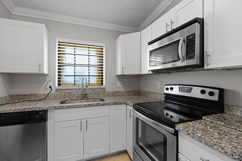 Photo of 2600 GREENWOOD Terrace #210, Boca Raton, FL 33431 (MLS # B26074573)