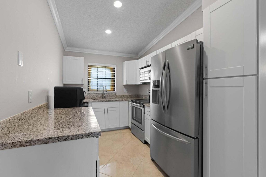 Photo of 2600 GREENWOOD Terrace #210, Boca Raton, FL 33431 (MLS # B26074573)