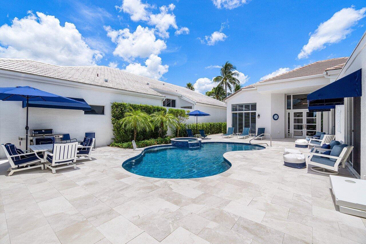 Available 1/5/25. Full golf membership and cart included with lease. This exquisitely renovated one story courtyard home spans 4,537 sqft and features 4 bedrooms and 4 bathrooms. Nestled within BallenIsles Country Club, it is now offered for seasonal lease fully furnished. Highlights include an airy open floorplan with high ceilings, a chef's kitchen, Casita guest house, a grill and pool bar, a heated spa-pool, and a 2-car garage. Pets permitted on a case by case basis. BallenIsles features 24 hour manned gates, a redesigned 115000 SF Clubhouse, 3 golf courses and a 65000 SF Sports Complex which includes a spa and salon, fitness center, world-class tennis facilities, resort-style swimming pool, and six dining areas noted for their variety of offerings, from casual to exceptional cuisine.