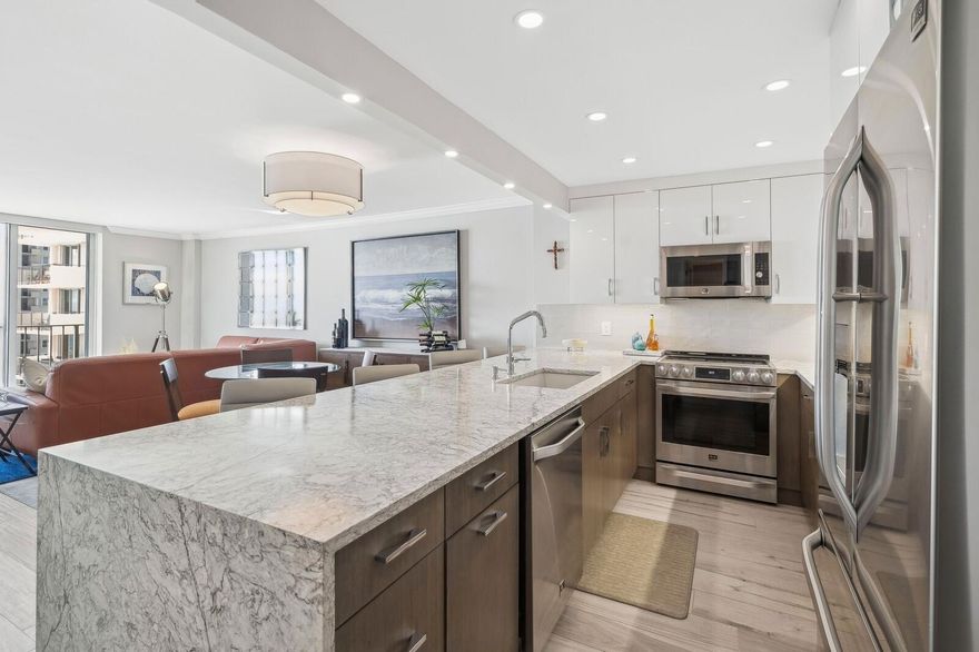 Enjoy stunning ocean views from every window in this beautifully updated fully furnished condo. Gorgeous 2021 kitchen renovation by Allied Kitchen includes quartz countertops, Italian cabinetry and all new appliances. Light wood porcelain tile throughout, impact windows and doors, electric blinds and plenty of closet space.  Close to shops, restaurants and groceries.  Full amenities building with 24 hour doorman, heated pool, fitness center, theater room, sauna, and social room. High speed Wifi, water and trash removal included in rent.