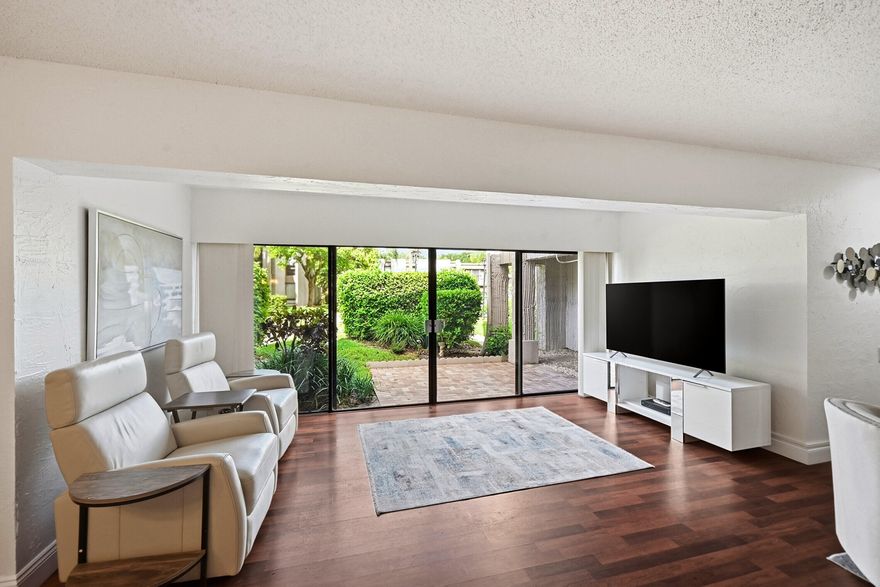 HUGE 1,500 square feet property that is Bigger than most people's homes and located in the best area of Boca Raton just 5 minutes from the Beach and 3 minutes from Town Center Mall! This unit looks New and it comes with all of the Brand New Furniture!!! There was just a New Paver Patio installed with views of the Pool and Garden area! The 2 Bedrooms are so Big that you have 2 Primary Suites with Walls of Windows in each one for tons of Natural Light. You even have Walk-In closets in these bedrooms giving you lots of room for all  your clothing. The Gourmet Kitchen is very large with lots of designer Cabinets and it is even an Eat In kitchen! The Family Room and Living Room is so large and Open and Airy and has Walls of Sliding Glass Doors overlooking the Paver Patio, Pool, and Garden area!
