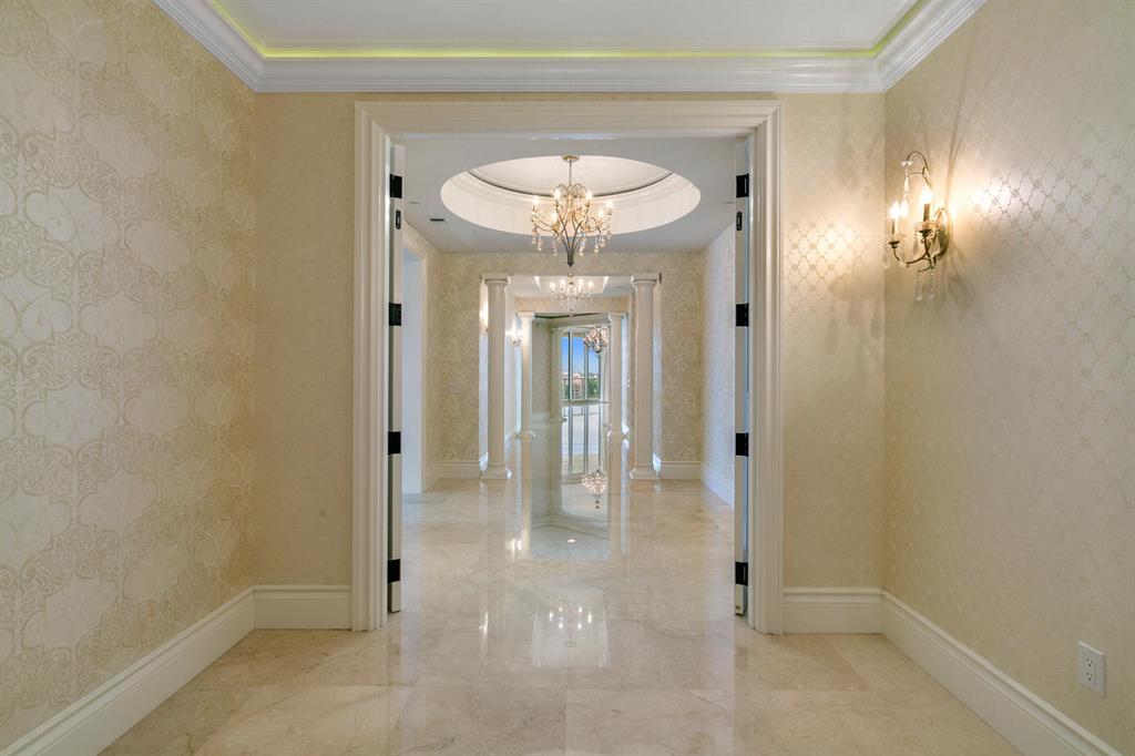 One of the largest condominiums in South Florida! Experience the ultimate lifestyle. The perfect blend of comfort, style and function. Over 7,440 SF of interior space. Multiple living areas with 9,179 total SF!! A substantial home office overlooking the ocean - no commuting! The great room spans 33'' X 33'' and includes a kitchenette area with bar, wine cooler, refrigerator, ice maker and dishwasher. Perfect for family gatherings. The kitchen includes top of the line appliances,....click on see more separate catering room. The dining room is suited for a crowd with additional eating area off the kitchen. The master suite is an oasis of relaxed spaces from the his and her bathing areas, separate walk in dressing rooms, a spacious ''getaway'' space for morning coffee or late-night chats