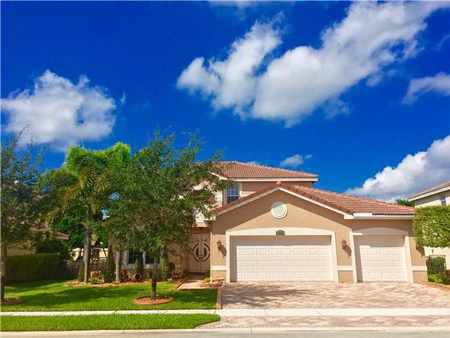 Immaculate 5 bdr,3 fbath, single family home in the man gated community of Sunset Falls. Stainless Steel appliances with granite kitchen counter tops and wood cabinets. Tile downstairs and hard wood upstairs. Impact windows all around, fresh new paint ins ide and out. Crown moldings, California wood cabinets in closets. New washer & dryer. 3 car garage with the 2 car converted into playroom and 1 car garage still available. Large patio with new pavers, playground included. Roof recently waterpressured.