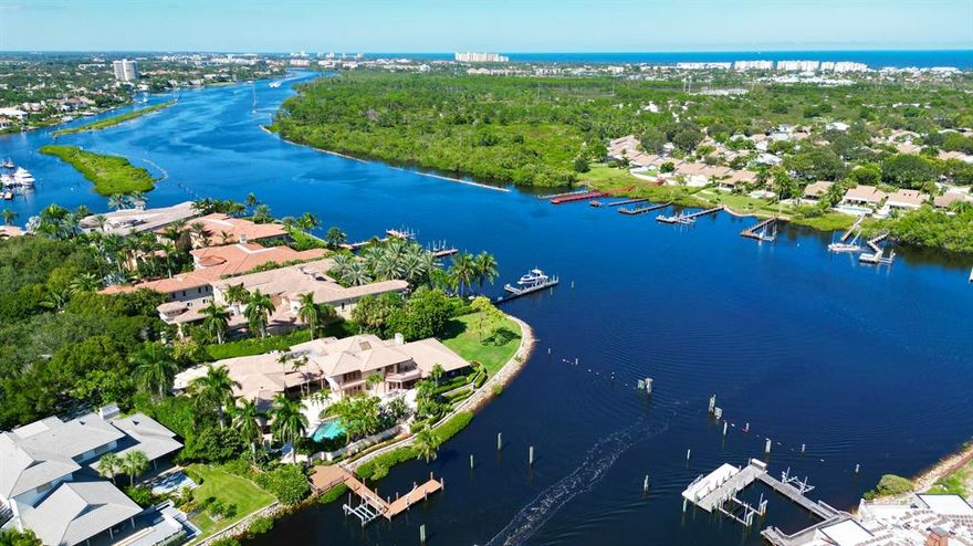 TROPHY PROPERTY with 300' of waterfrontage and Southeast exposure.  This property is one of VERY FEW properties that has direct Intracoastal frontage and protected waterfrontage for a large yacht. This Transitional style home is located on a quiet cul-de-sac with a park like setting in Prestigious Admirals Cove.  Main house features a large luxurious primary suite with dual baths and closets, walk-in shower and spa like tub with panoramic water views, open kitchen to family room, glass and wood bar, cozy living room with fireplace, atrium and much much more!  Guest house has bedroom/living room, kitchenette, and private bath, all situated around the private pool and patio.

This is the perfect opportunity to have it all!