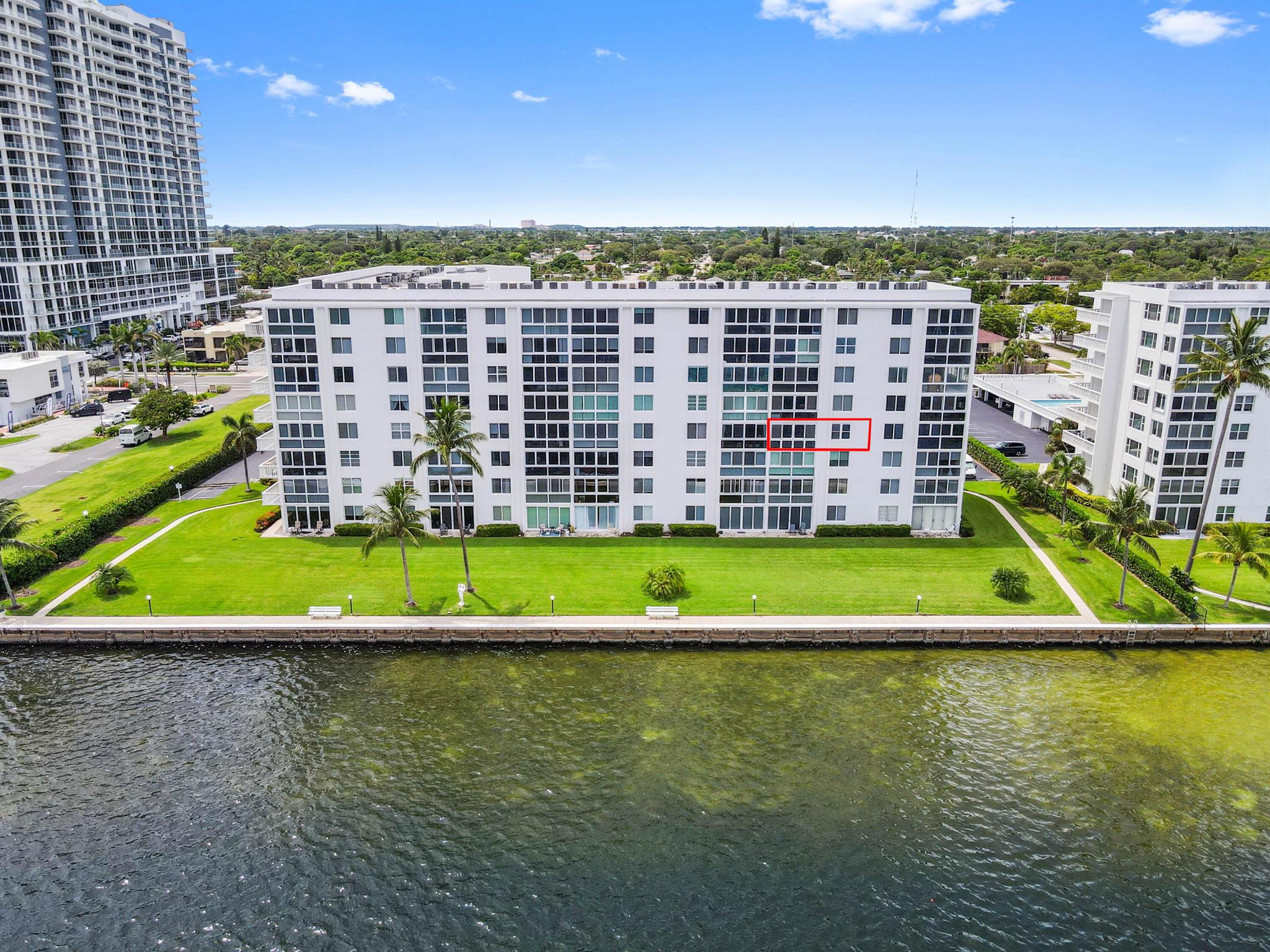 Welcome to this stunning waterfront condo in Lake Harbour Towers, a gated community offering a lifestyle of tranquility and convenience. This residence is a remarkable opportunity to create your dream home with a breathtaking Intracoastal backdrop. The unit is a blank canvas, ready for your personal vision. The spacious layout is bright and open, featuring a beautifully updated kitchen with white shaker-style cabinets, a full suite of white appliances, and an in-unit stackable washer and dryer, providing modern functionality.
