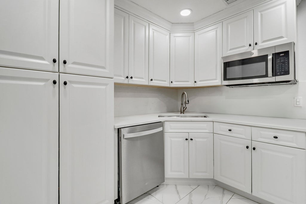 Photo of 935 Orange Drive, Lake Park, FL 33403 (MLS # R11151377)