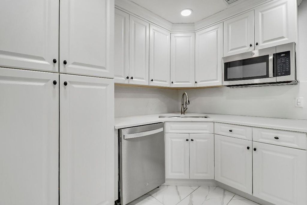 Photo of 935 Orange Drive, Lake Park, FL 33403 (MLS # R11151377)