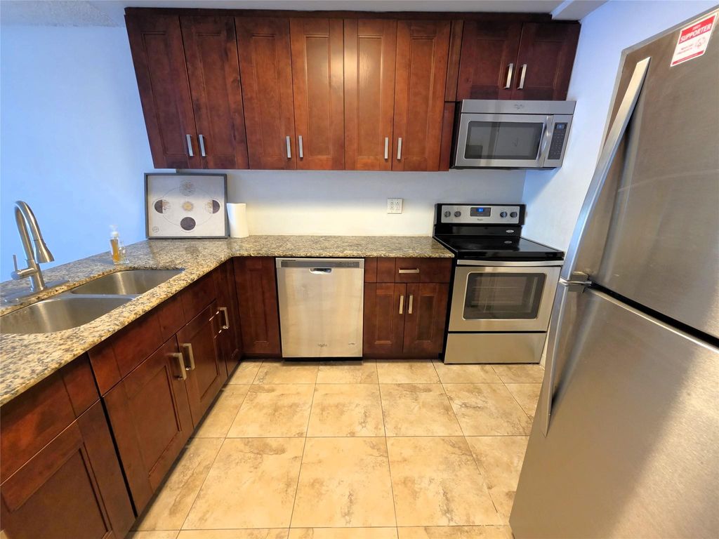 Photo of 2320 S Cypress Bend Drive #106, Pompano Beach, FL 33069 (MLS # F10520183)