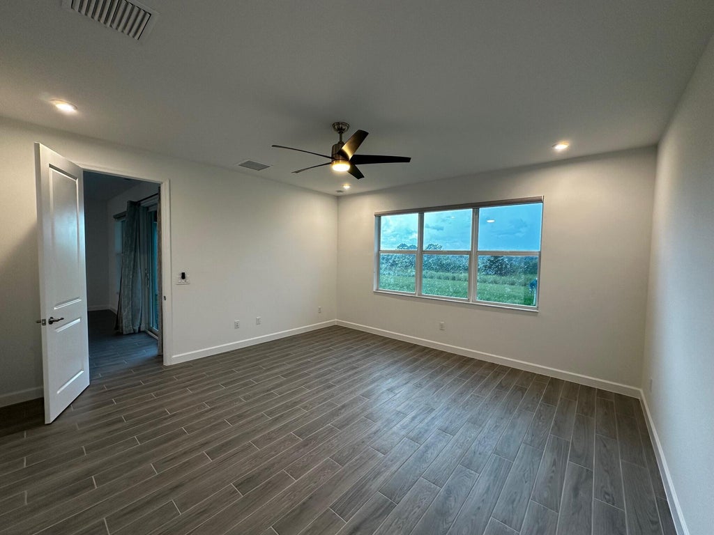 Photo of 9148 SW Remy Lane, Port Saint Lucie, FL 34987 (MLS # R11006316)