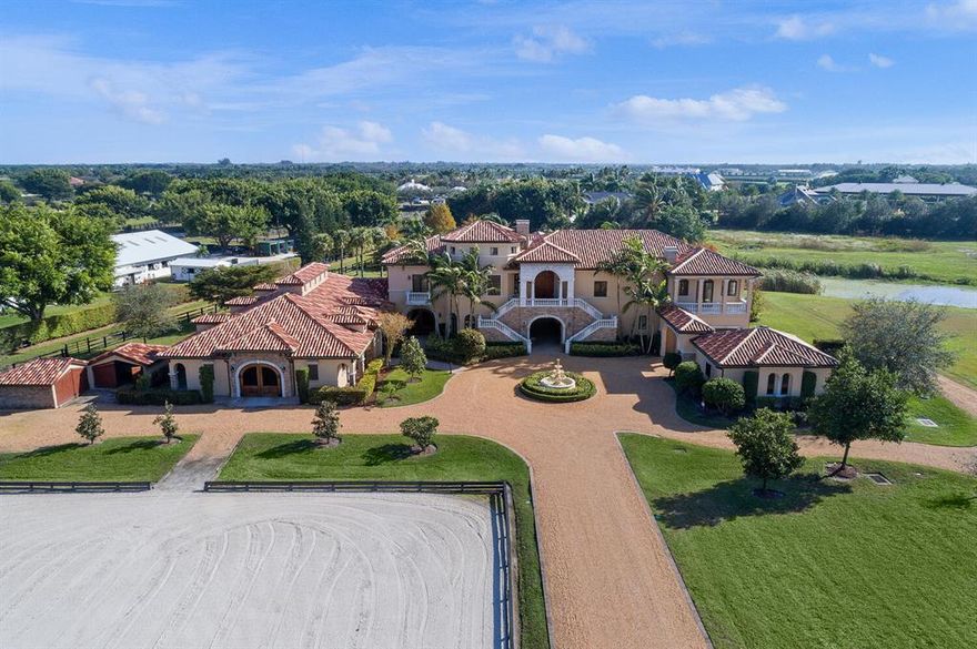 A rare opportunity to own an elegant one-of a-kind equestrian estate for a great price! Situated on more than 6 acres in the private gated community of ''Southfields'' the home & barn have been recently updated. This desirable location is just a short hack to both the WEF & Global showgrounds. The property offers ample room to add a covered arena and/or grass grand prix field along with the outdoor arena.  The property boasts 16 stalls, 2 grooming stalls, tack & feed rooms, an office with 1/2 bath and a freshly remodeled 2Br/1Bth staff apartment. The 3Br/3.5Bth owner's residence above with elevator boasts a brand new center-island kitchen with porcelain counters, professional gas range, great room with fireplace, formal dining room with wine cellar & media/game room with new wood floors.