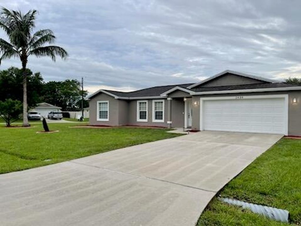 Photo of 2484 SE Renick Avenue, Port St Lucie, FL 34952 (MLS # R10901785)
