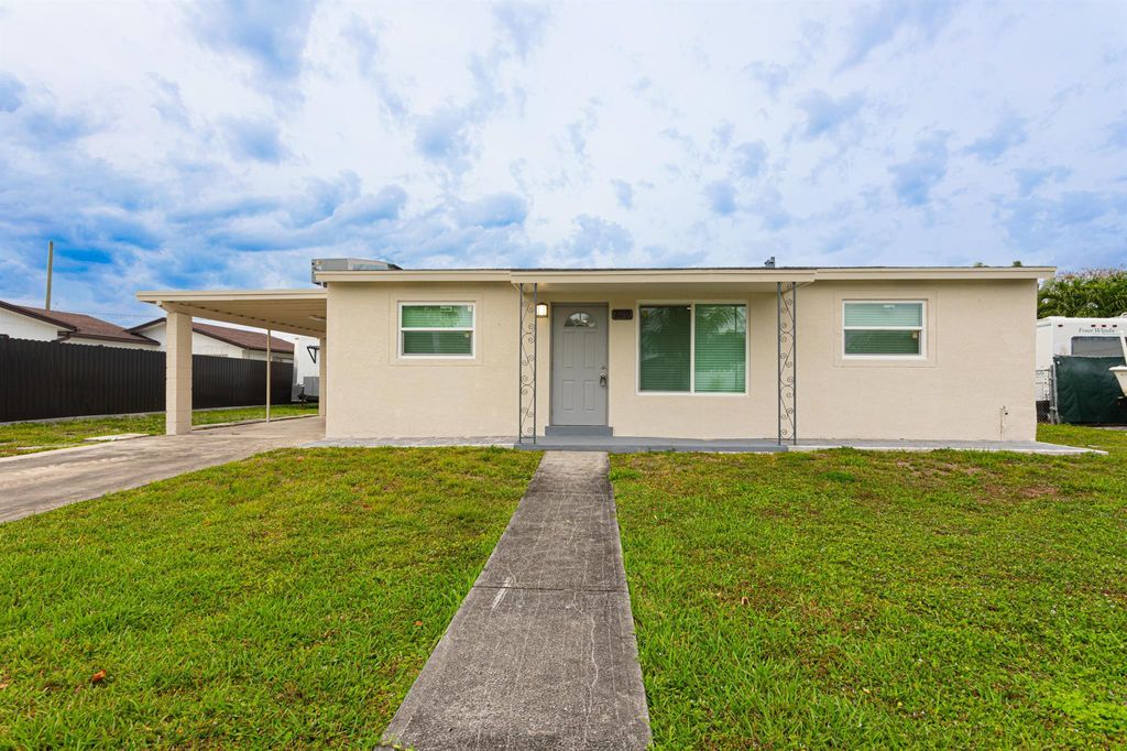 Photo of 320 Winged Foot Road, Palm Springs, FL 33461 (MLS # R10975496)