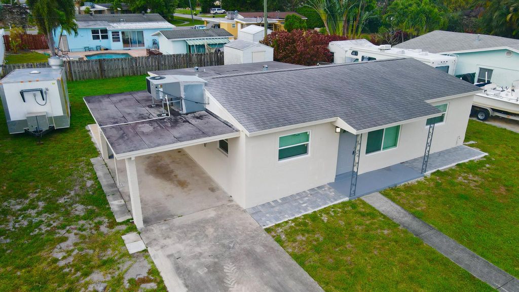 Photo of 320 Winged Foot Road, Palm Springs, FL 33461 (MLS # R10975496)