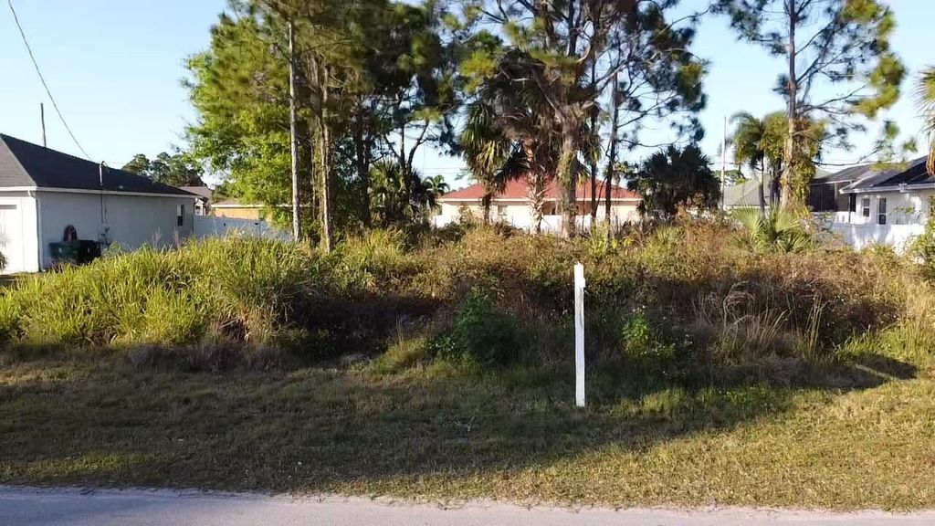 Photo of 1233 SW Medina Avenue, Port Saint Lucie, FL 34953 (MLS # R10828275)