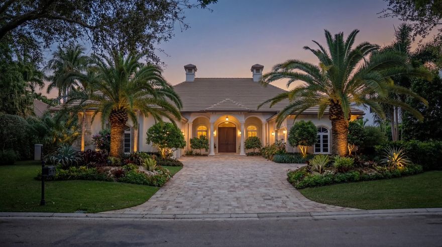 Set on a sprawling .55-acre homesite with exceptional privacy, this beautifully maintained one-story residence at Admirals Cove offers timeless Palm Beach charm, gracious proportions, and outstanding value behind the gates of one of South Florida's most prestigious communities. Built in 2004, the home features 4 bedrooms, a richly appointed wood-paneled study, 5 full baths, 1 half bath, and a desirable split floor plan with the master suite privately positioned opposite the guest bedrooms.  Designed for both everyday comfort and elegant entertaining, the open-concept kitchen flows seamlessly into the main living areas and is outfitted with premium Viking appliances. Crema Marfil flooring adds warmth and sophistication throughout, while the renovated master bath brings a fresh, luxurious  feel to the owner's retreat. Additional highlights include a whole-house generator, three-car garage, and a six-year-old roof for added peace of mind.  Outdoors, the property truly shines. The backyard is one of the finest in the community—lushly landscaped, extraordinarily private, and centered around a beautifully redesigned pool area that creates a true resort-like setting.  Ownership in Admirals Cove provides access to an unmatched luxury lifestyle featuring 45 holes of championship golf, world-class tennis and pickleball, a state-of-the-art fitness center, seven dining venues, a 54-slip marina, private boutique hotel accommodations for members and guests, an elite performance golf center with TrackMan, Toptracer, and premier club-fitting technology, a 10,000-square-foot full-service spa, a 10,000-square-foot salon, and a renowned provisions market with an extraordinary wine program.  This is a rare opportunity to secure one of the best values inside the gates of Admirals Cove where luxury waterfront and golf club living reach their highest level.