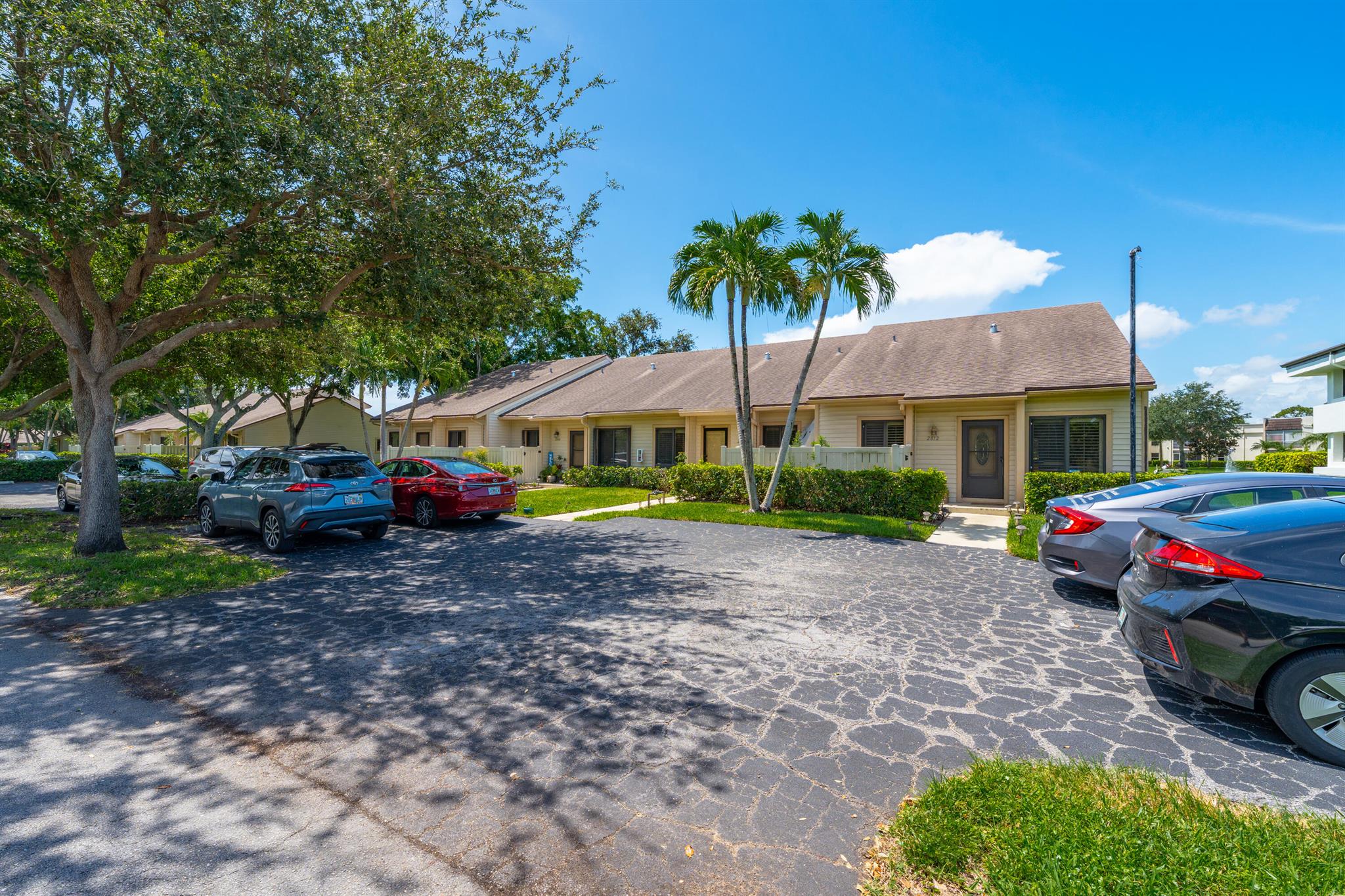 Beautiful Lakefront townhome in Trendy Delray Beach (The Village by the Sea) Upgraded Kitchen and master bath. Seller has it set up as a 2/2 with a huge Master wing / Office. It can easily be converted to a 4 bedroom.You have your own Backyard where you can grow your own vegetable garden. Subdivision has a small gym, pool,tennis,Picketball and a Clubhouse. HOA payments include water, cable and Insurance. Roof is a couple of years old. Impact windows and doors. Very East to show!