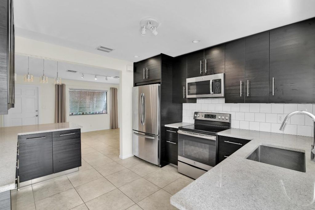 Photo of 320 NE 1st Avenue, Delray Beach, FL 33444 (MLS # R11082991)